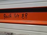 a sign that says rock set 88 on the shelf of a store