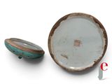 a small bowl and a small bowl on a white surface