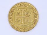 an image of a gold coin with a cross on it