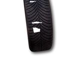 an image of a tire with a white stripe on it