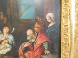 a painting of a man holding a baby in a room