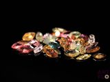 multi - colored gems on a black background