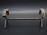 a metal object that is sitting on a black surface