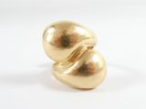 an image of a close up of a gold object on a white surface