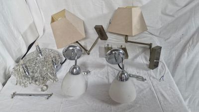 three lamps that are sitting on a white table