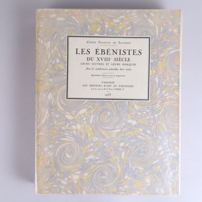 a book with a yellow and white cover sitting on top of a table