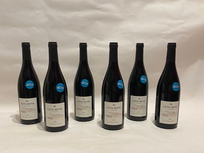 six bottles of wine are lined up in a row on a white background