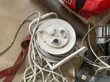 a lot of wires and tools on the floor