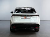 a white car that is parked in a room