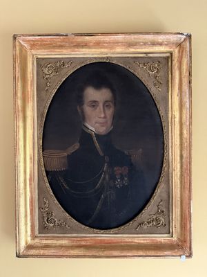 portrait d'un homme en uniforme militaire dans un cadre doré