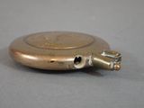a small metal object that is sitting on a table
