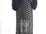 an image of a black and white dress on a mannequin stand