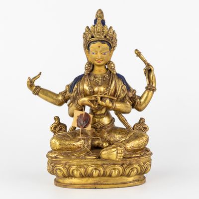 Bouddha Laxmi assis, bronze doré et patiné, 20e siècle.