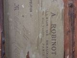 a piece of paper on the back of a wooden cabinet