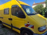 a yellow van that is parked in a lot
