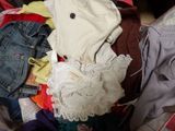 a pile of clothes that is sitting in a suitcase