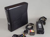 a video game console and a game controller on a table