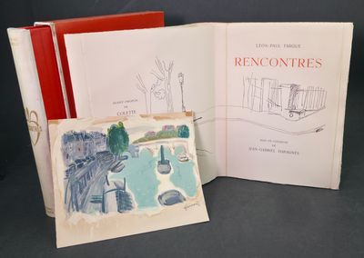 two books are open on a table with a drawing of a house