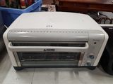 a toaster oven sitting on the floor in a room