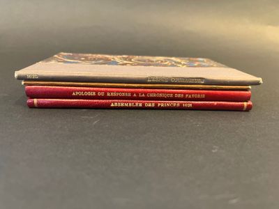 three books are stacked on top of each other on a table