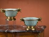 two bowls sitting on top of a marble table