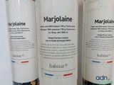 three bottles of marjolaine sitting on a table