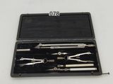 a black case with tools in it on a white surface