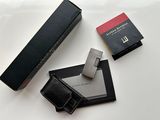 a box of cigarettes and a lighter on a table