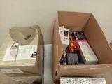 two boxes of electronic equipment sitting next to each other on the floor