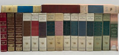 a lot of books that are lined up on a shelf