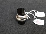 a silver ring with a black top and a price tag