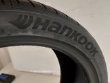 a close up of a tire on a table with a cell phone