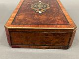 an image of a wooden box with a decorative design on it