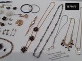 many different types of jewelry displayed on a table