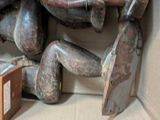 a box with a bunch of wooden sculptures inside of it