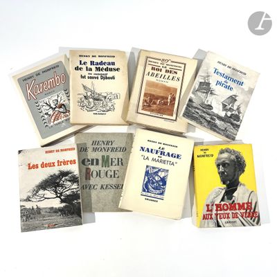 several books are stacked on top of each other on a white surface