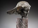 an image of a sculpture of a woman ' s head on a marble base