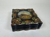 a black box with a picture of a castle on it