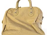 an image of a yellow handbag on a white background