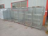 many cages lined up in front of a building