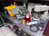 many different types of kitchen appliances on the counter