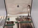 silverware in a case with spoons, knives, spoons and spoons