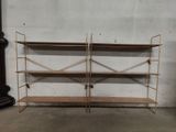 two shelvings are stacked on top of each other in a room