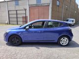 a blue car parked in front of a building
