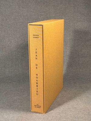 a yellow book box with the cover open on a grey background