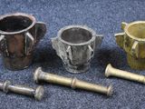 several different types of metal items are sitting on a blue carpet