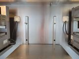 stainless steel counter top in a commercial kitchen with ovens