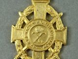 an image of a gold medal with a red ribbon around it