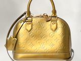 Sac à main Louis Vuitton en cuir doré orné d'étoiles