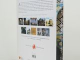 the back cover of a book with a picture of a building in the background